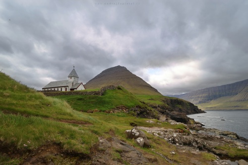 Church on a Shore under a Mountain photography